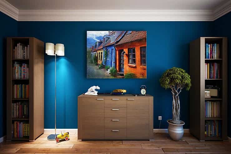 A blue room featuring a painting on the wall, highlighting the theme of Deck Varnishing & Timber Coating.