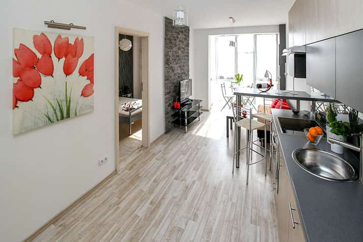 A well-designed kitchen in an apartment by the river, showcasing contemporary decor and recent residential painting.