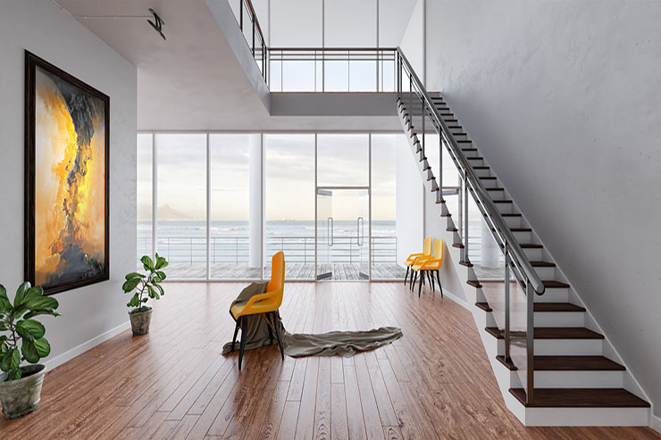A modern living room featuring stairs and a vibrant painting on the wall, showcasing a stylish residential design.